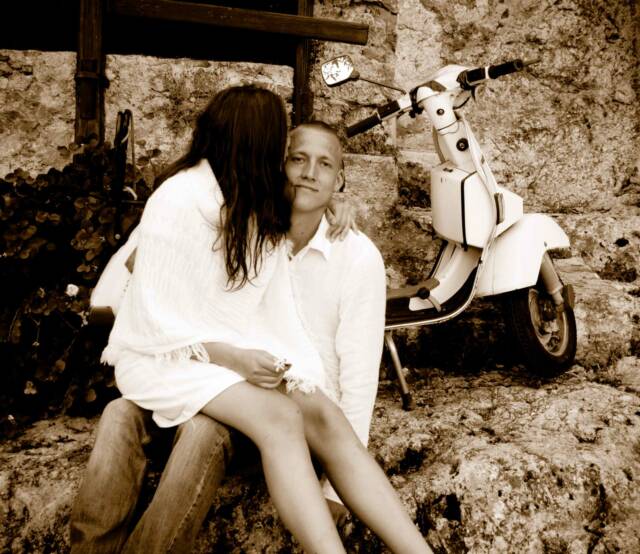 Italian couple in love with parked vespa- Tuscan Weddings and Events